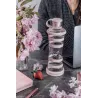 Bouteille i9 Compassion rose sur un bureau, près d'un ordinateur portable